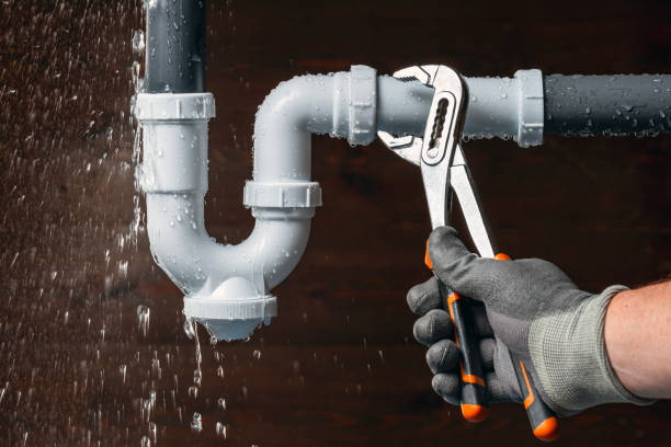 Professional Plumber technician working in Benton, MS